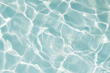 Texture of water in swimming pool for background