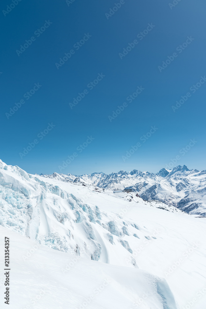 Winter snow covered mountain peaks in Caucasus. Great place for winter sports Winter snow covered mountain peaks in Caucasus. Great place for winter sports