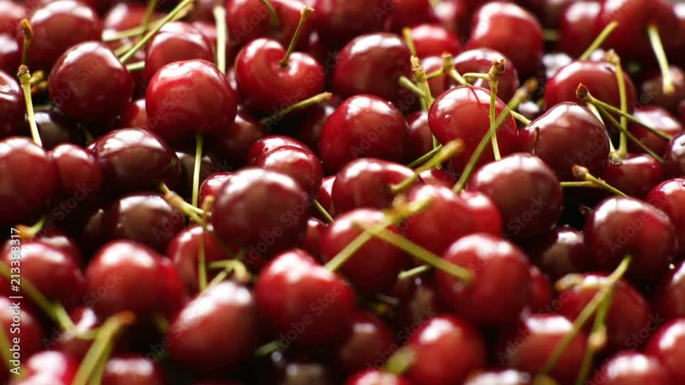 Background 4k video of ripe cherries rotating