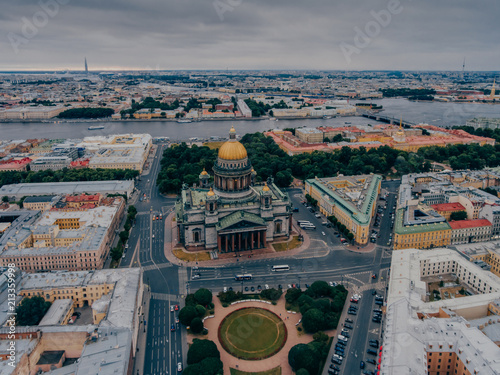 View from height of St Isaac`s Cathedral, dark cloudy sky. Architectural monument. Center of Petersburg. Panoramic view. St Isaac`s Square photo