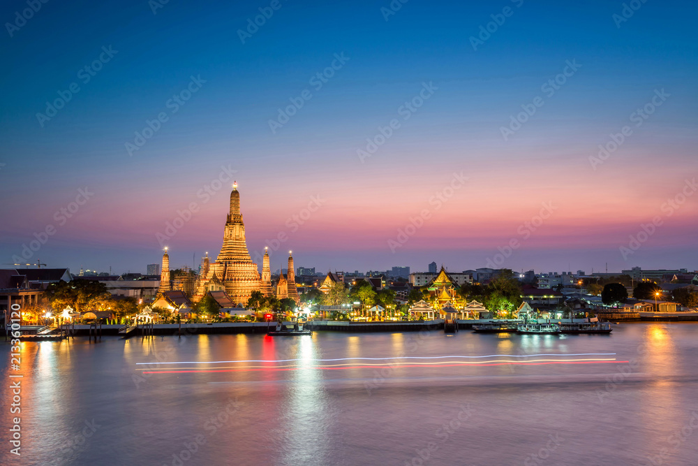 Beautiful sunset at Wat Arun Temple in Bangkok Thailand. Wat Arun is among the best known of Thailand's landmarks and icon of Bangkok city, Thailand and Travel in Asia.