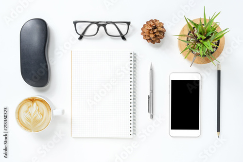 White hipster office desk table with supplies. Top view, flat lay.