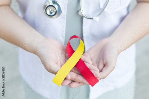 Red and Yellow awareness ribbon for Hepatitis C, HIV/HCV Co-Infection and Surviving family members of Suicide victims.World hepatitis day