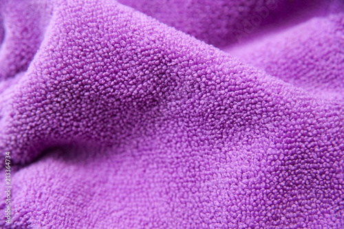 Violet terry fabric in the form of a background for anything. Violet background from microfiber
