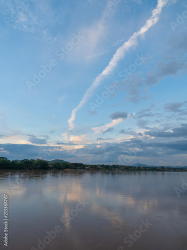 Blue sky reflection on river © Keerathi