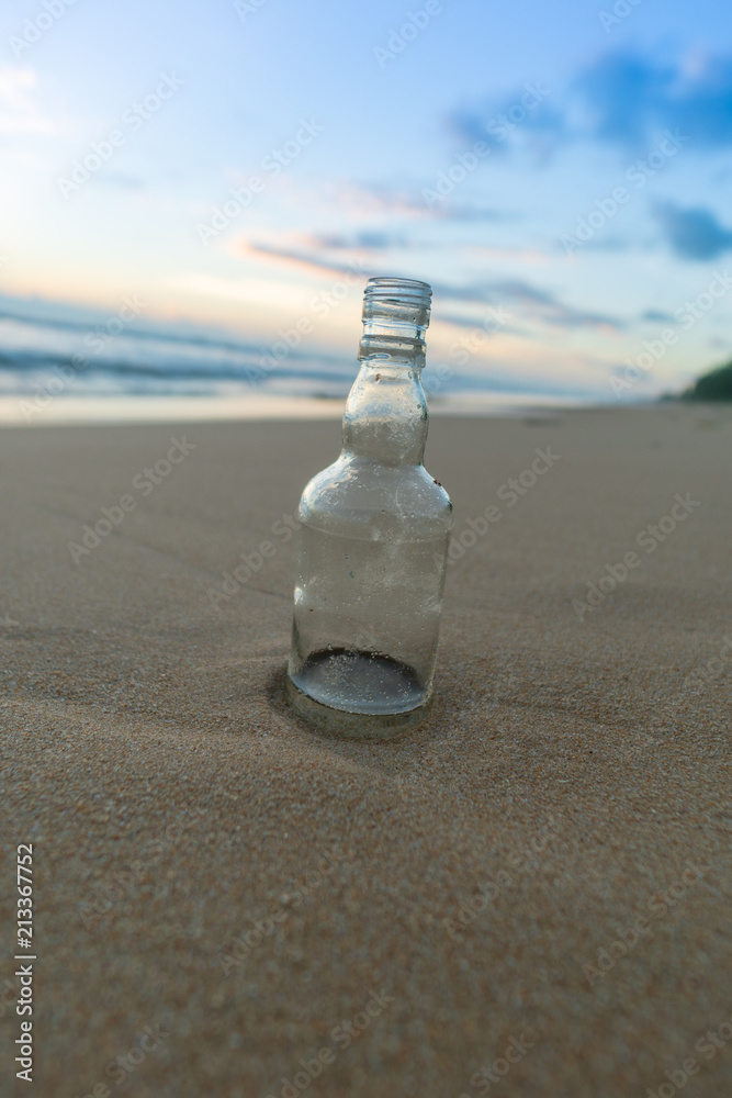 Glass bottle with beatiful beach sunset landscape Glass bottle with beatiful beach sunset landscape