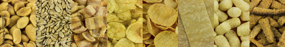 Snack, nut, potato chips  on a plate. Wooden table. Salty food for beer