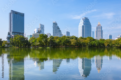 Business district cityscape from a park with blue sky