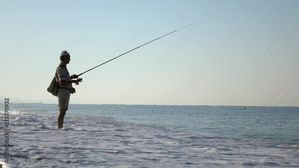Fisherman fishing on the sea coast. Fisherman fishing on the sea coast.