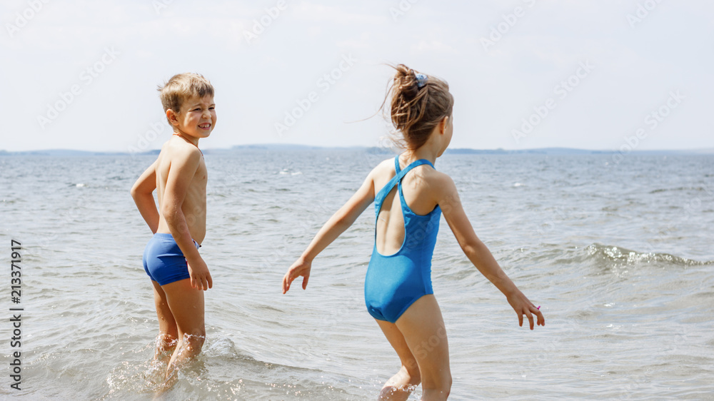 Children have fun playing on the seashore