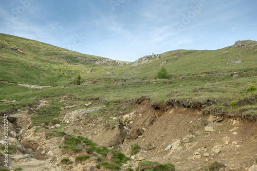 View of Bucegi Mountains, Bucegi National Park, Romania, clear blue sky, few clouds, sunny summer day, perfect for hiking