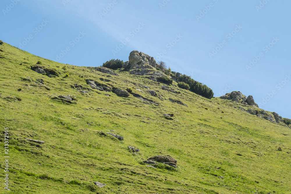 View of Bucegi Mountains, Bucegi National Park, Romania, clear blue sky, few clouds, sunny summer day, perfect for hiking