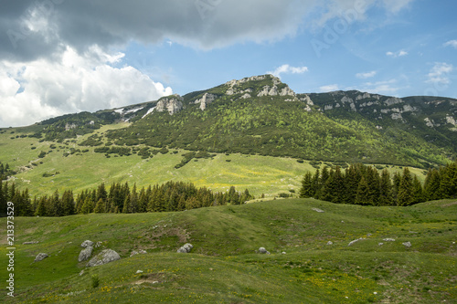 View of Bucegi Mountains, Bucegi National Park, Romania, clear blue sky, few clouds, sunny summer day, perfect for hiking