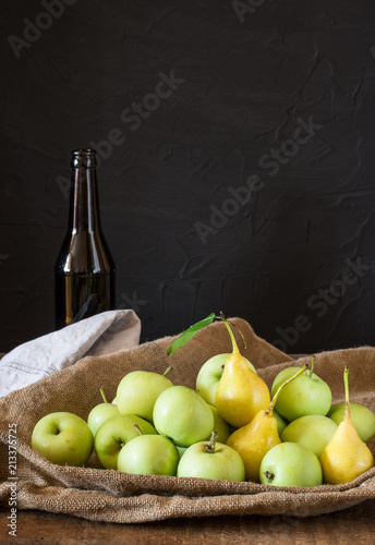 Ripe red and green apples on wooden background. Apples in bowl. Garden fruits. Autumn fruits. Autumn harvest. Yellow pears. Apple cider. Fruit vinegar. Apple vinegar.