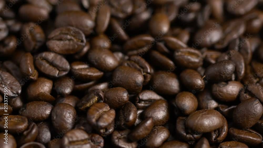 Coffee beans. On a wooden background rotation Coffee beans. On a wooden background rotation