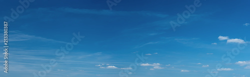 Panorama of beautiful blue sky with clouds on a hot summer day.