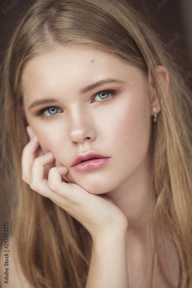 young girl with fingers on her cheek young girl with fingers on her cheek