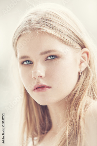 portrait of a girl with blond hair in a high key