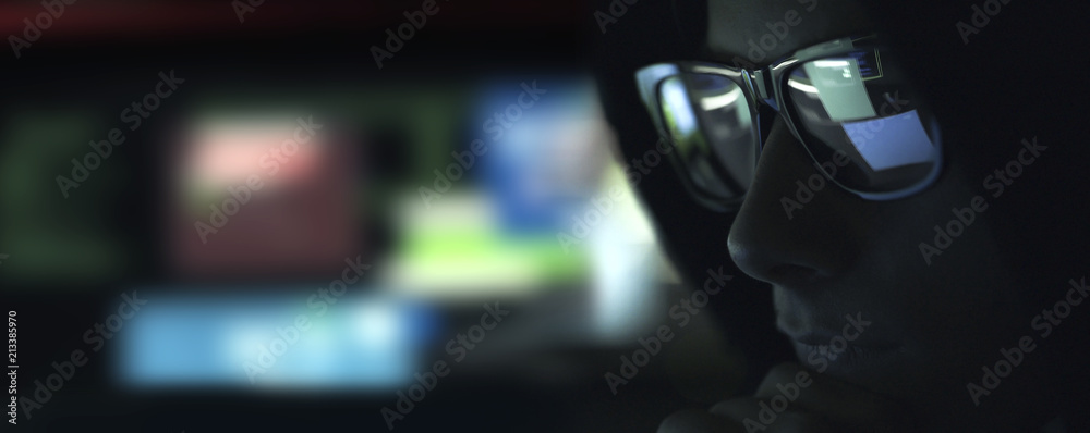 Nerd hacker with glasses in the dark Nerd hacker with glasses in the dark
