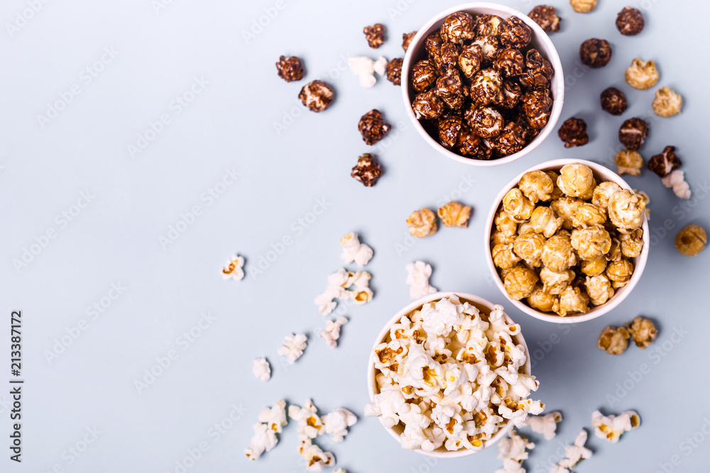 Sweet and salted popcorn on a blue background Sweet and salted popcorn on a blue background