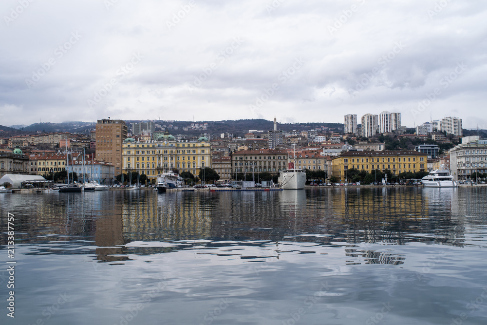 Buildings and boats along the Rijeka water front in Croatia