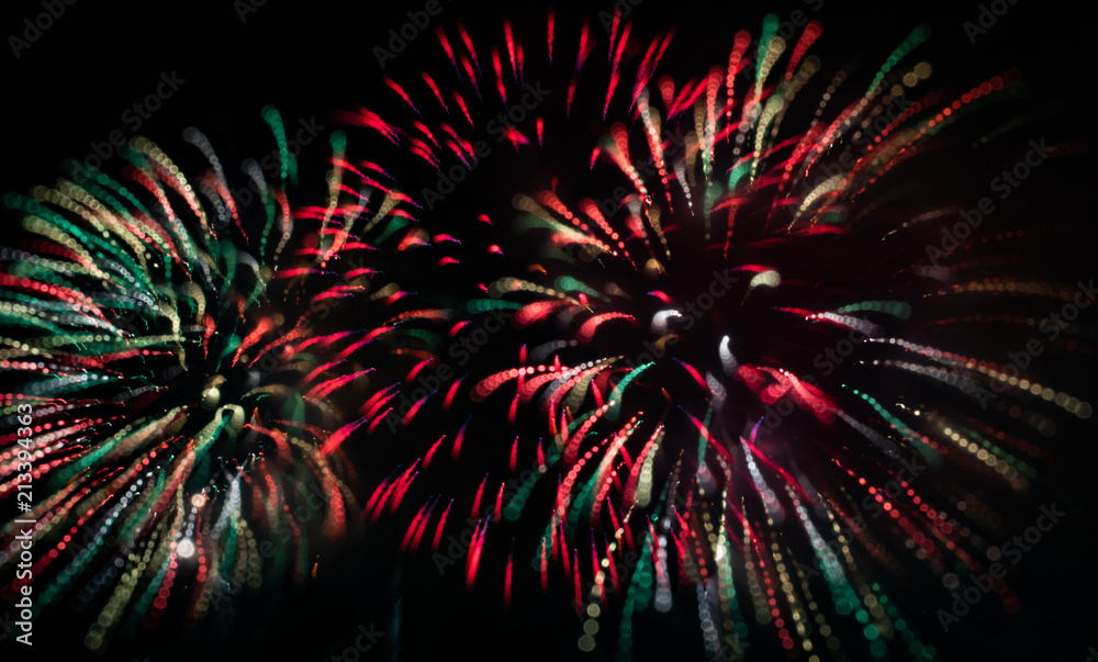 Fototapeta premium Abstract Colorful Red and White and Green Fireworks with Black Sky Background