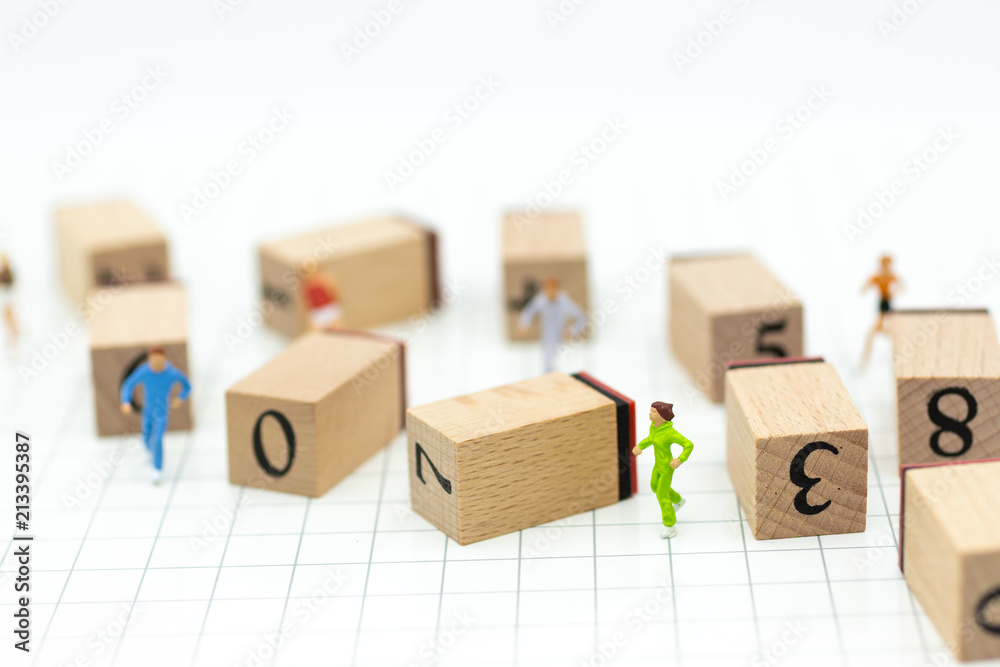 Miniature people running to stack of number wooden block . Image use for healthy , exercise concept.