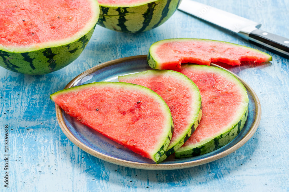 Slices of watermelon on a plate. Refreshing summer fruit Slices of watermelon on a plate. Refreshing summer fruit