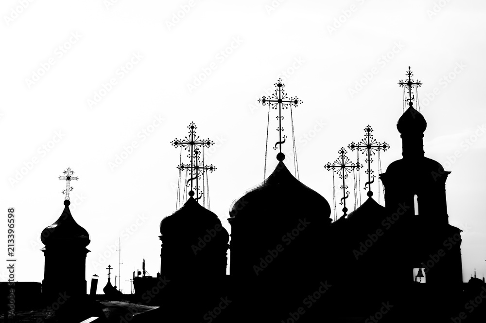 Domes and crosses of churches in black and white