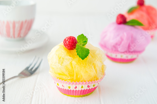 Concept of artificial, plastic food. GMO, E numbers and genetically modified sweets. Use of chemicals in the food industry. Future food Technology. Unhealthy snacks on white background. Copy space.