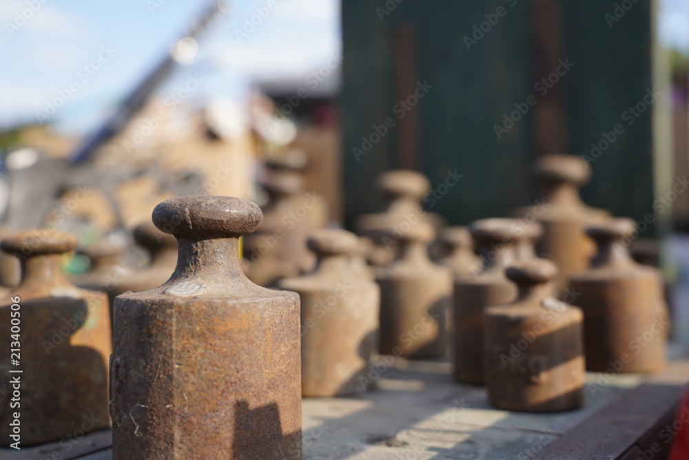 Old rusty weights of different sizes