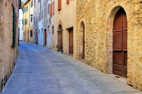 Narrow street in historic center of Montalcino town, Val d'Orcia, Tuscany, Italy