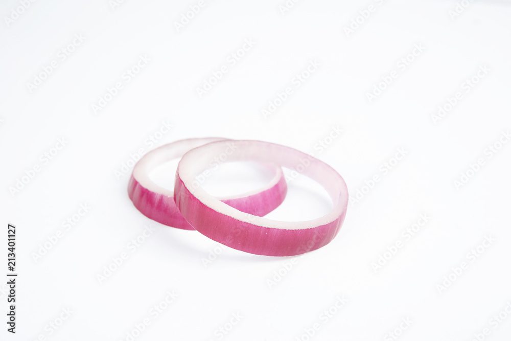 Fresh slices of red onion on white background
