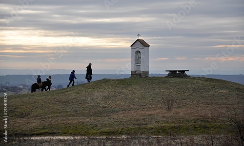 people and small chapel in the country