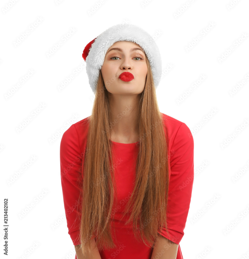 Young beautiful woman in Santa hat on white background. Christmas celebration Young beautiful woman in Santa hat on white background. Christmas celebration