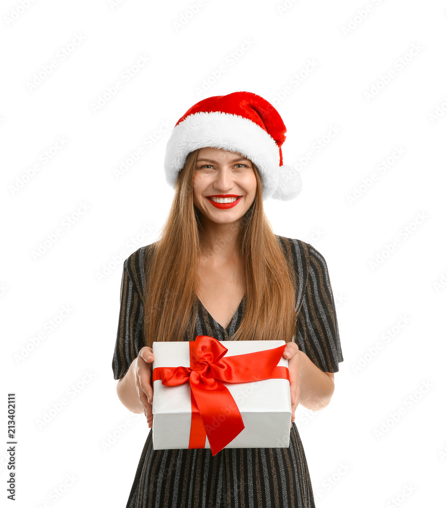 Young beautiful woman in Santa hat with gift box on white background. Christmas celebration Young beautiful woman in Santa hat with gift box on white background. Christmas celebration