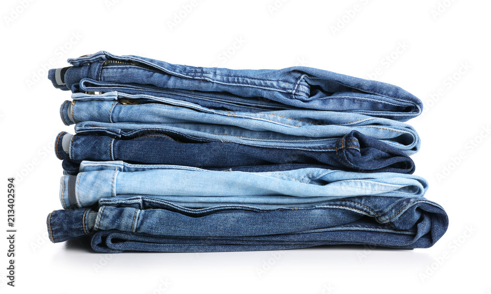 Stack of stylish jeans on white background Stack of stylish jeans on white background