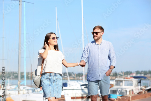 Young hipster couple in jean clothes on pier © New Africa