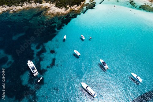 Foto Aerial view of some yachts on an emerald and transparent Mediterranean sea