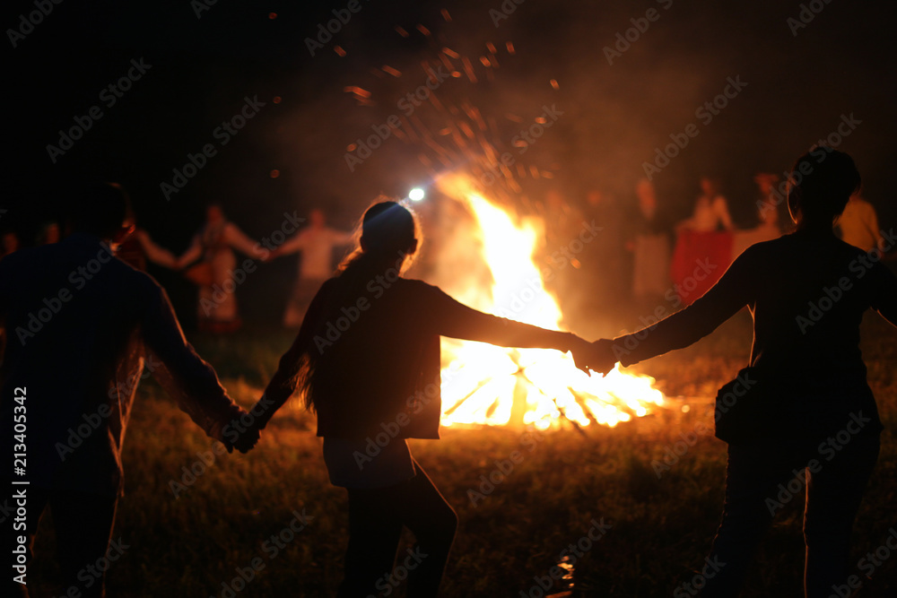 Vologda, July 2018, the day of Ivan the bath. People dance around the fire. - obrazy, fototapety, plakaty 