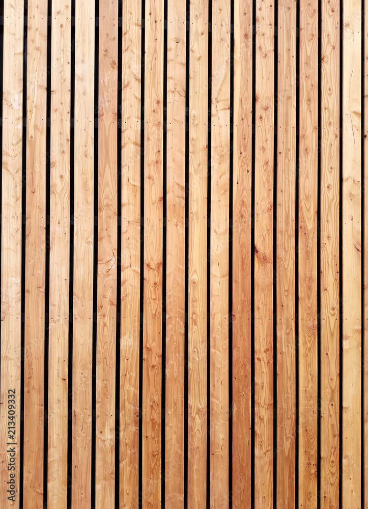 Obraz premium The siberian larch facade is made of wooden planks