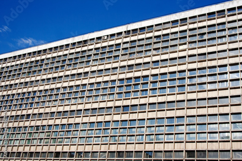 Industrial building exterior with geometric pattern on a summer day