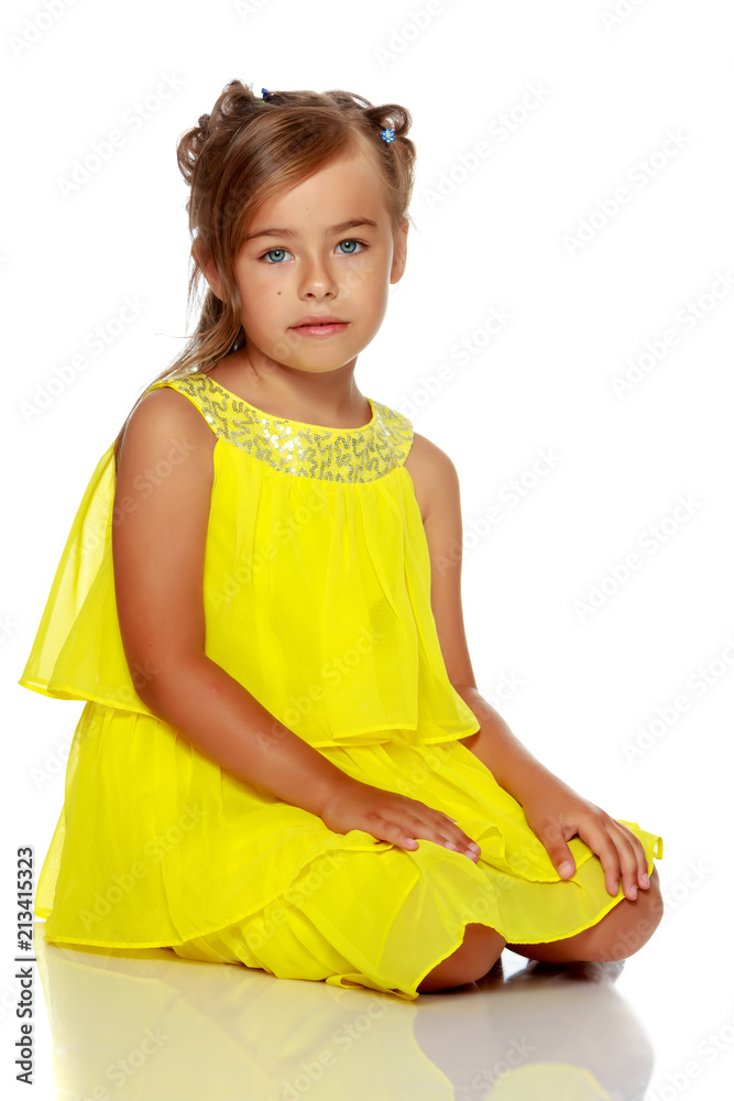 Little girl is sitting on the floor. Little girl is sitting on the floor.