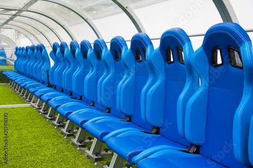 Blue bench or seat or chair of staff coach in the stadium of football