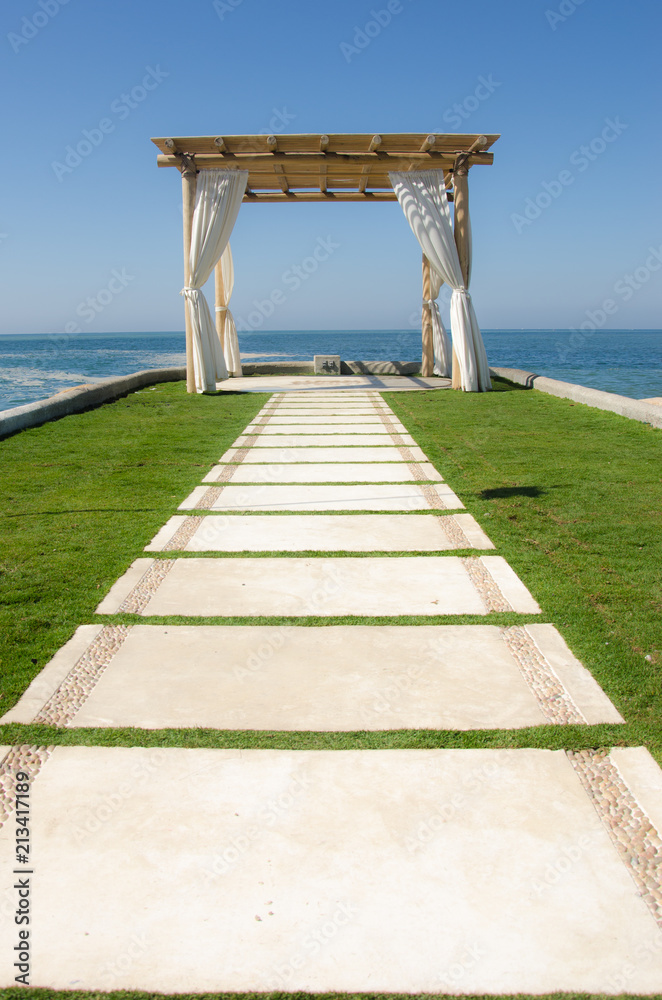 Tourist walkway to beachfront wedding pagoda