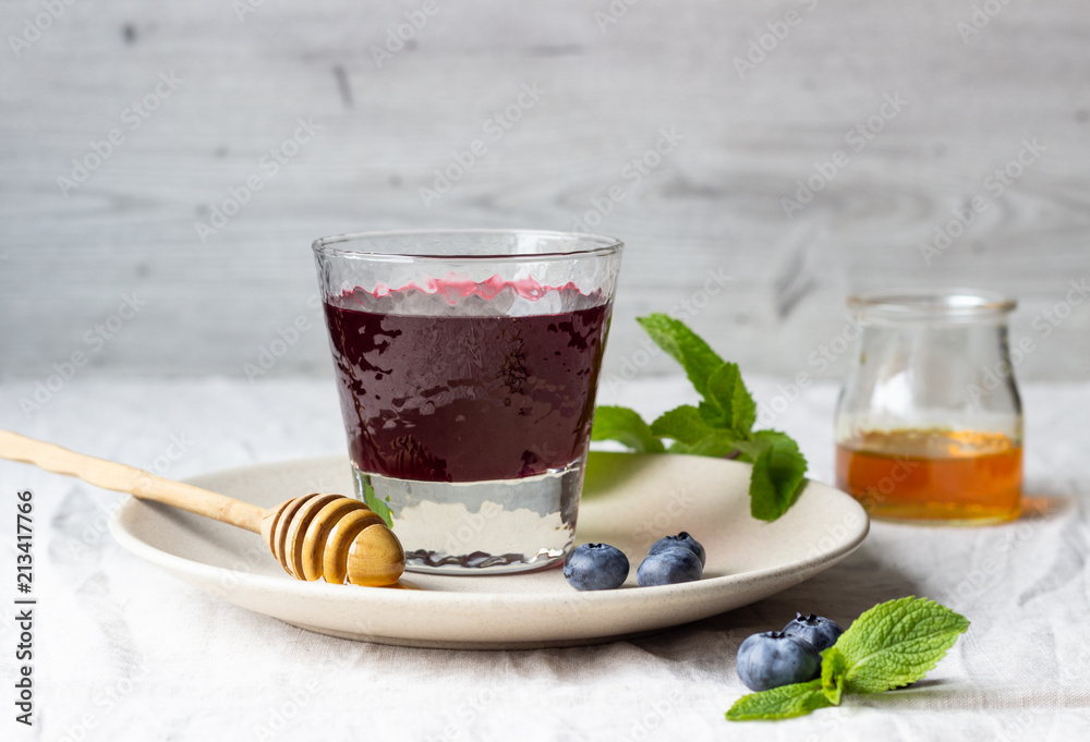 Healthy detox drink with blueberries, honey and mint. Healthy detox drink with blueberries, honey and mint.