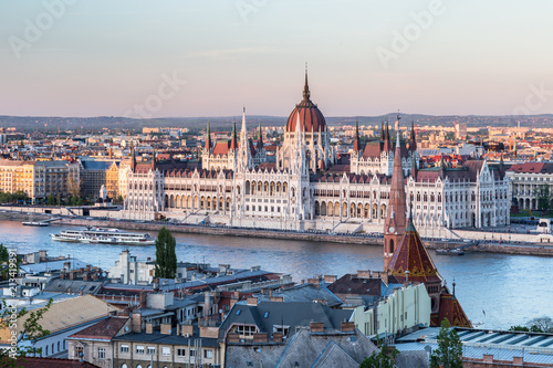 Sunset in Budapest. View of hungarian parliament, the most beautiful building in Europe in neo-gothic style. 