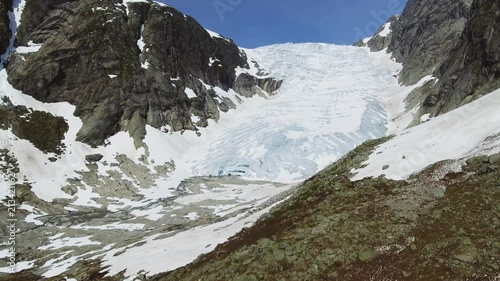 Tuftebreen - glacier in Norway is nearby to Steinmannen and Bakli. Aerial view. photo