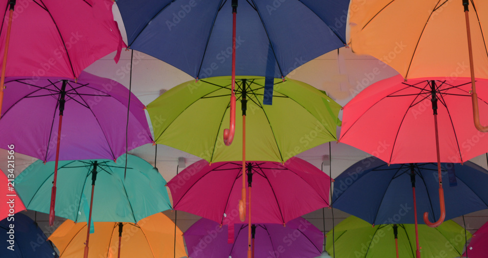 colorful outdoor umbrellas, bright positive background, panorama,