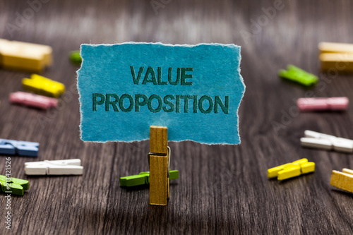 Text sign showing Value Proposition. Conceptual photo service make company or product attractive to customers Clips symbol idea script notice board text capital cardboard design.
